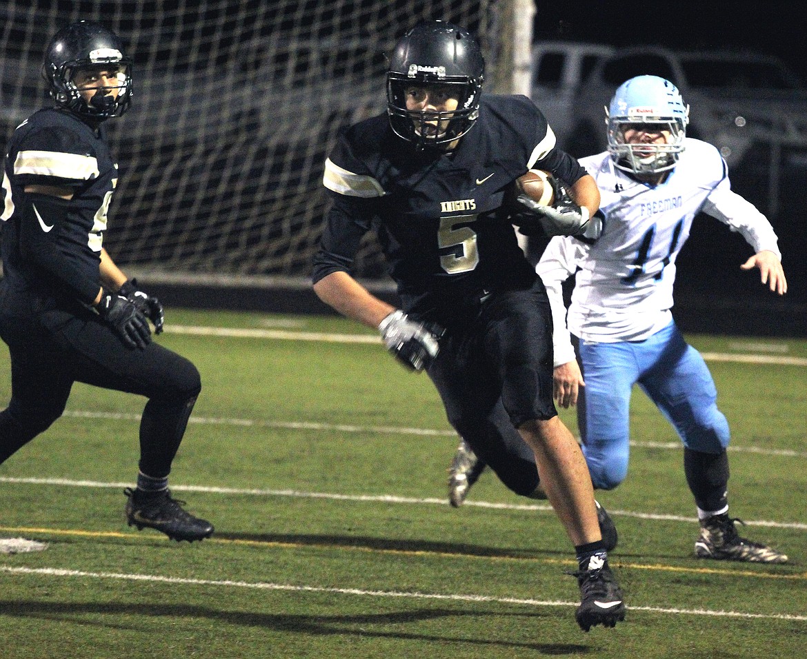 Rodney Harwood/Columbia Basin HeraldRoyal punt returner Angel Farias (5) breaks through the first wave of the Freeman punt team on his way to a 93-yard return for a touchdown Friday night in the 1A state playoffs at David Nielsen Stadium.