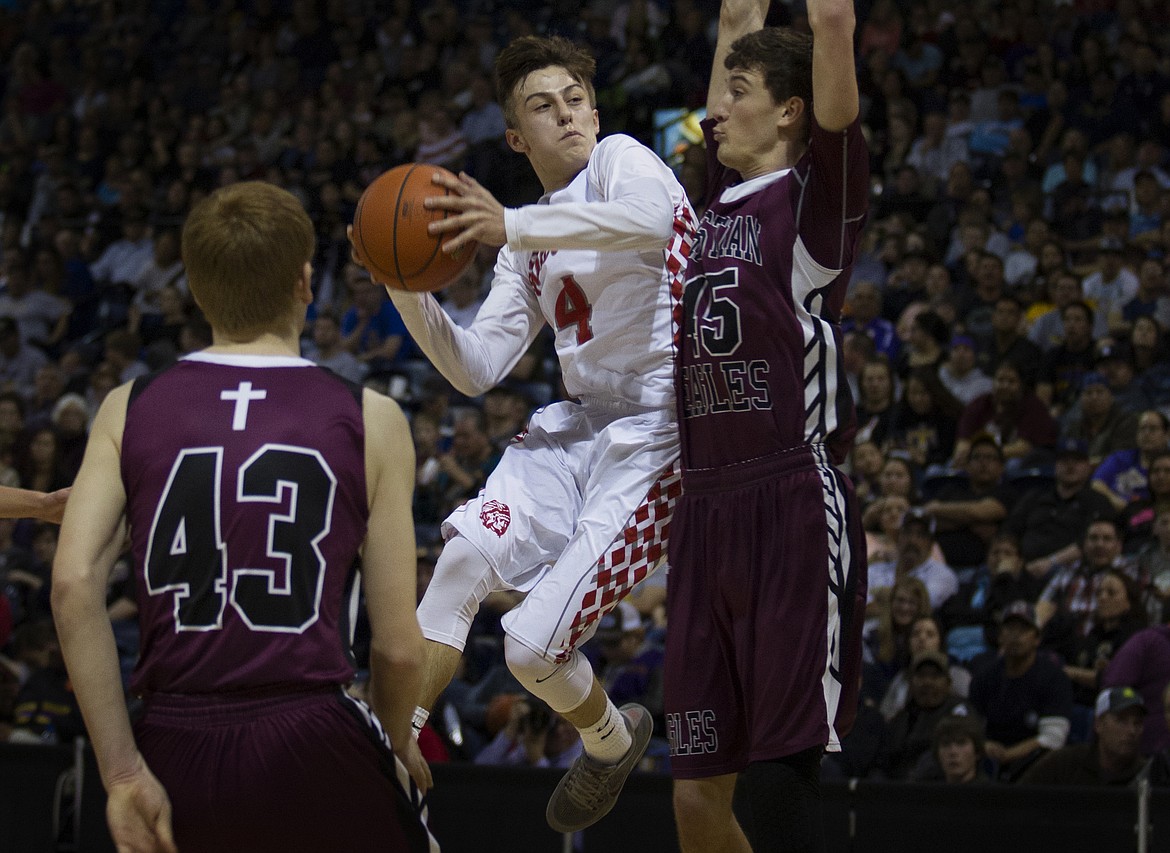 ARLEE HIGH School Phillip Malatare drives to the basket during the MHSA Class C basketball championship game against Manhattan Christian. (photo by Jeremy Weber/Lake County Leader)