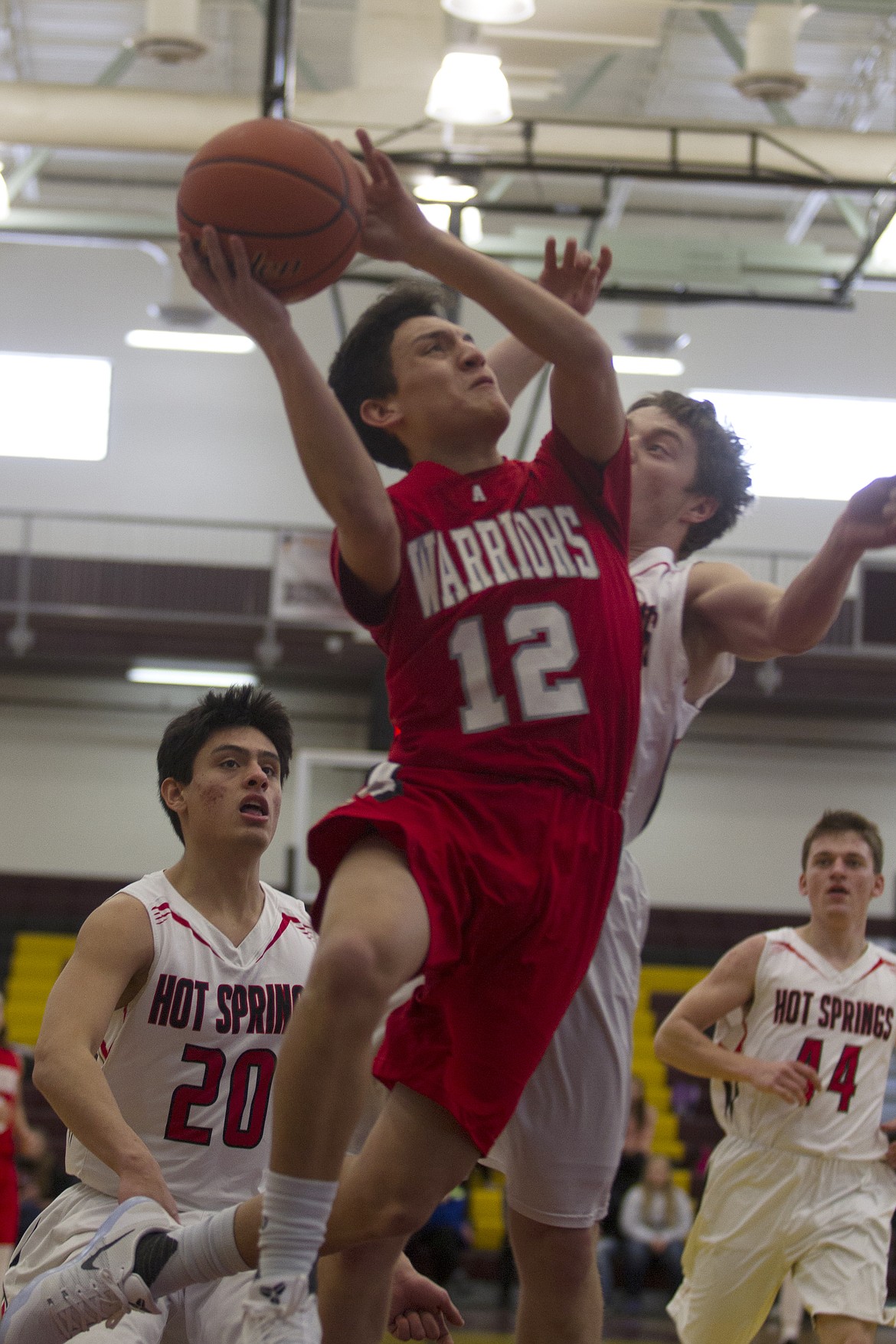 ARLEE WARRIORS gaurd Greg Whitesell drives to the basket during a 2016-2017 regular-season game. Whitesell looks to be one of the Warriors' key components in their quest to win back-to-back MHSA Class C state basketball titles. (Photo by Jeremy Weber/Lake County Leader)