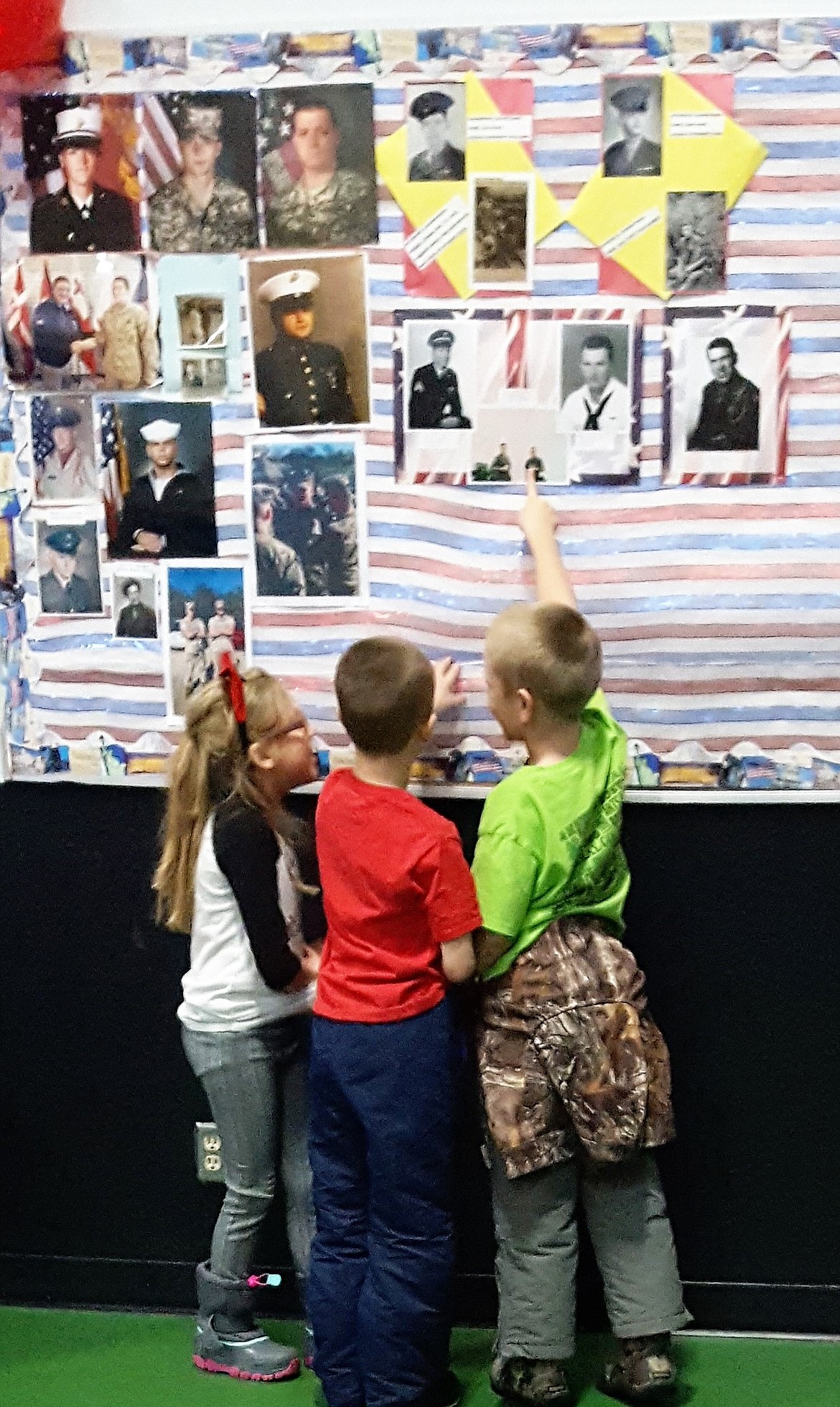 Elementary students check out a wall to honor local veterans which was on display during St. Regis School&#146;s annual breakfast on Thursday, Nov. 9.

(Photos courtesy of Joe Steele)