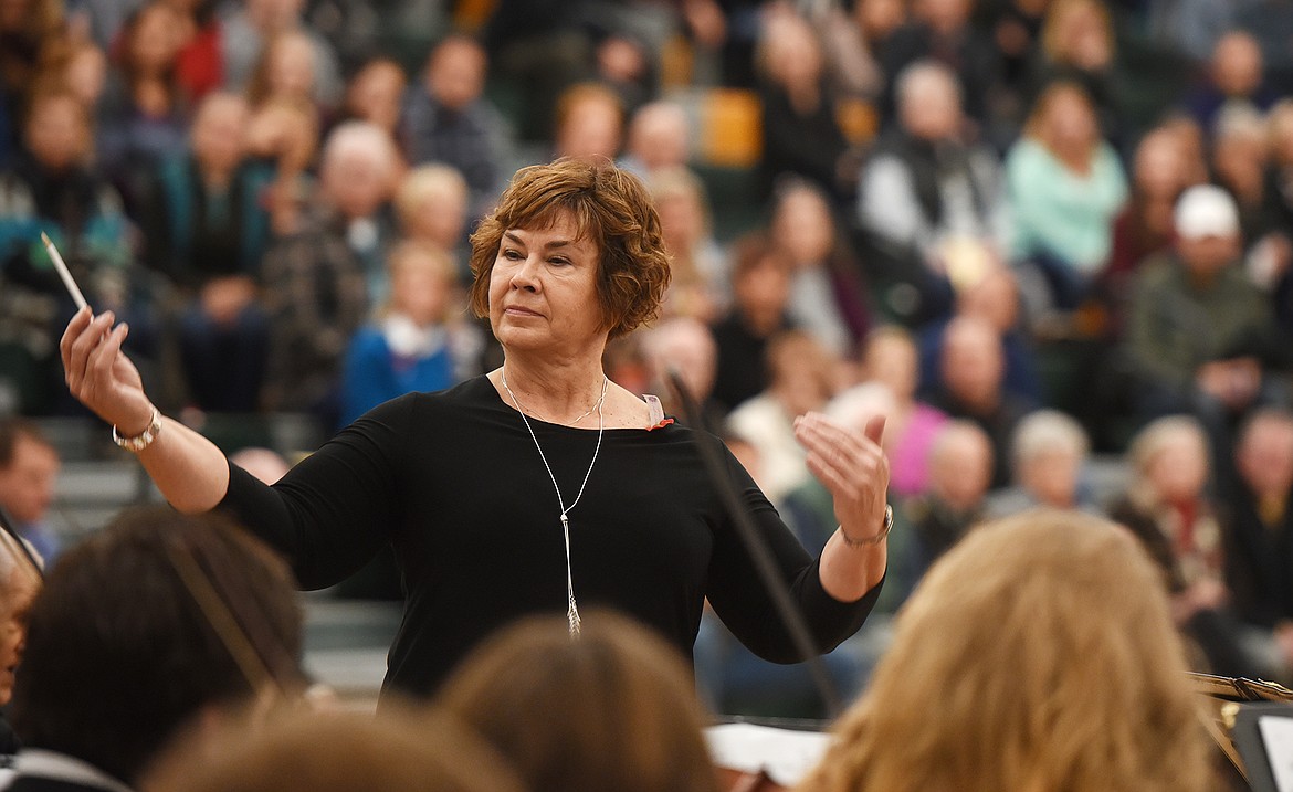Jeanne Solberg conducts the Whitefish High School Orchestra during the Veterans Day Community Event at Whitefish High School on Friday, November 10.(Brenda Ahearn/Daily Inter Lake)