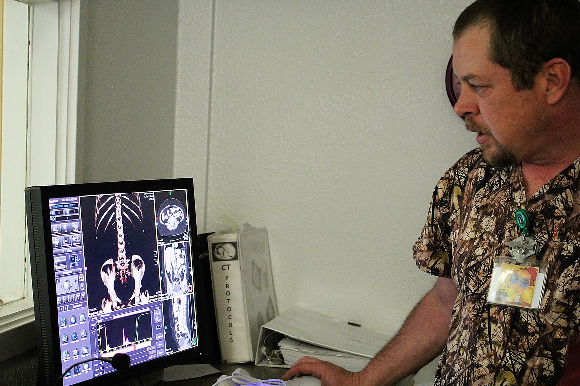 Radiology Technician, Roland McCrea, shows students images from the CT Scanner at Mineral Community Hospital on Nov. 8. The scanner shows internal organs, bones, and the nervous system. (Kathleen Woodford/Mineral Independent).