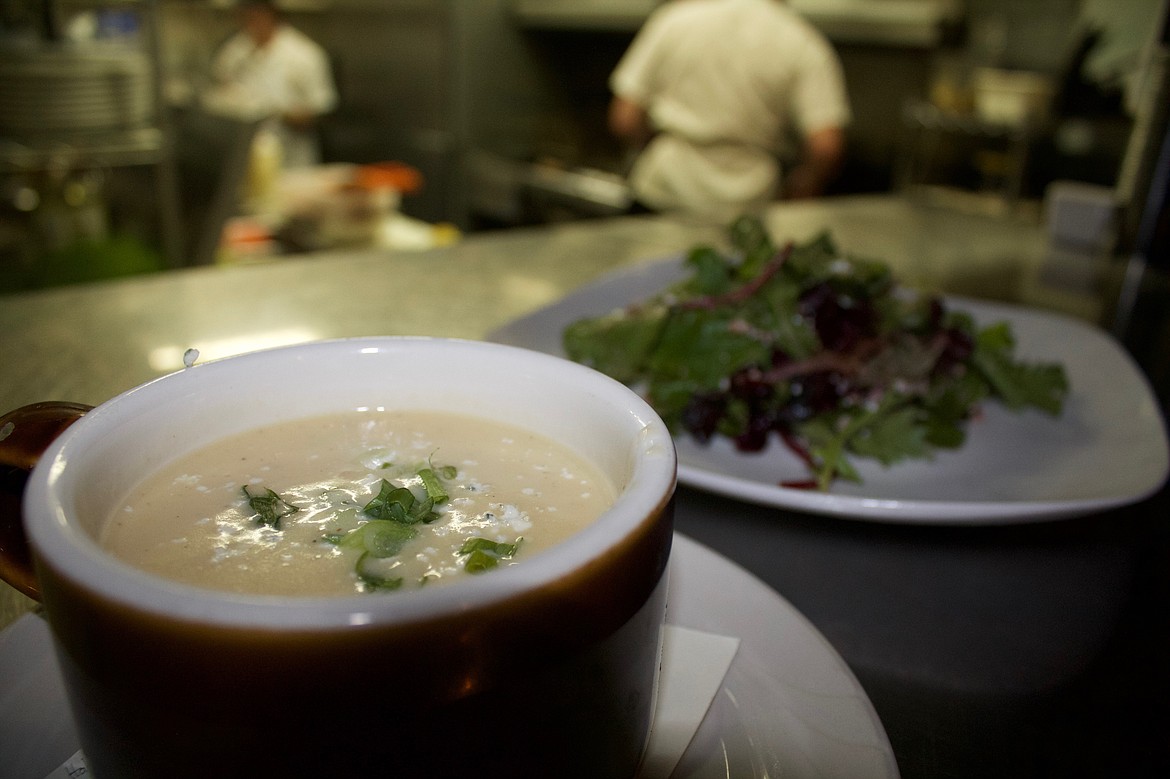 A potato bisque made with beer cheese and a mixed green salad await a hungry customer at The Bluebird.