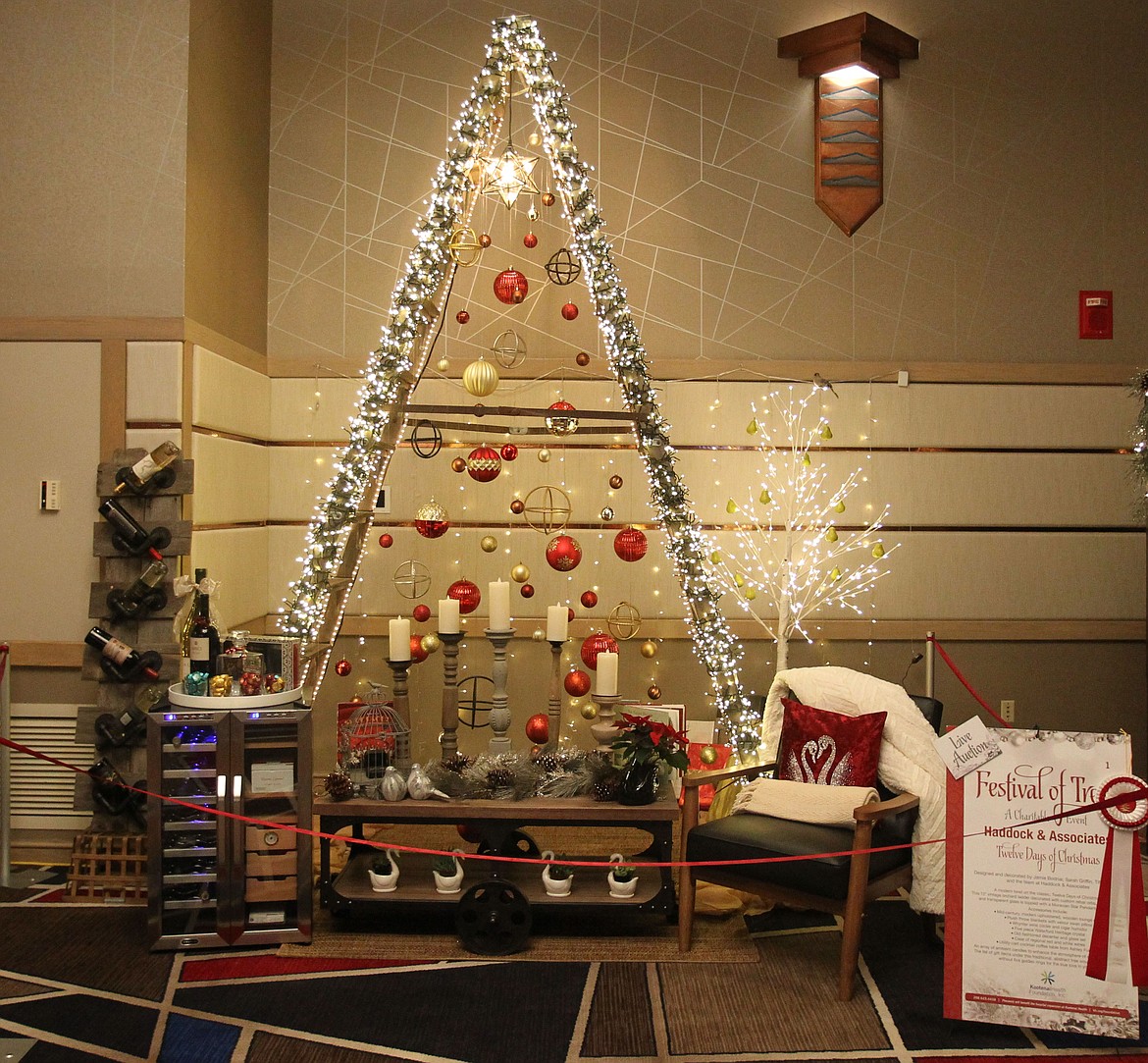 The &quot;Twelve Days of Christmas&quot; by Haddock and Associates is a &quot;tree&quot; made out of a 12-foot vintage ladder decorated with custom rebar orbs, metallic bulbs and transparent glass and topped with a Moravian star pendant chandelier. (DEVIN WEEKS/Press)