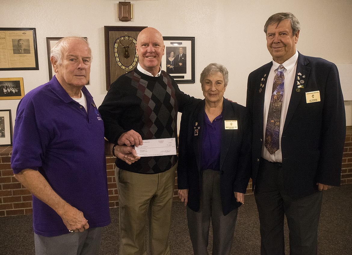 The Elks Club presents Press Christmas for All with a $5,000 donation. From left, Elks Trustee Dick Gardner, Press Managing Editor Mike Patrick, Elks Secretary Mary Lou Riley, and Elks Exalted Ruler Pat Braden.

LOREN BENOIT/Press