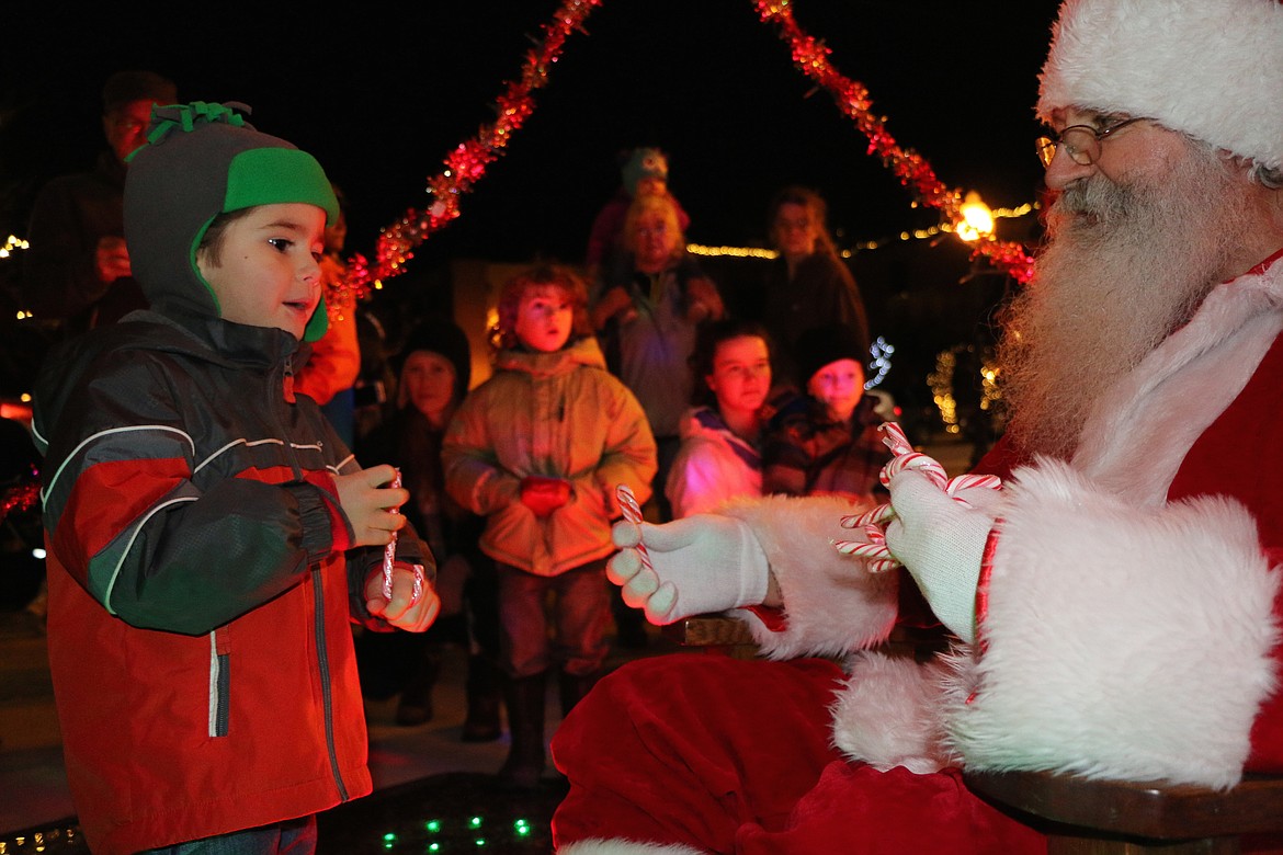 (Photo by CAROLINE LOBSINGER)
A young fan stands in awe as he meets Santa Claus as the jolly old elf stopped by Friday&#146;s Christmas tree lighting ceremony at Jeff Jones Town Square to help the community kick off the holiday season.