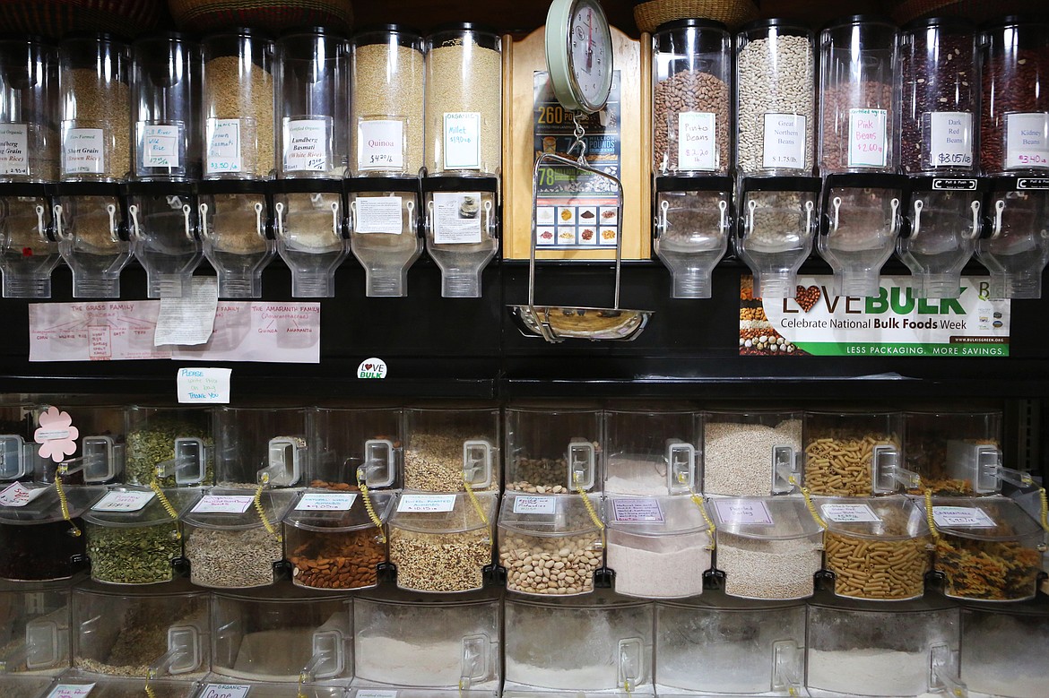Nuts, grains, seeds and beans fill larger plastic dispensers at Camas Organic Market and Bakery in Hot Springs. The market is offers produce and meat produced by local growers along with other essentials. (Mackenzie Reiss/Daily Inter Lake)