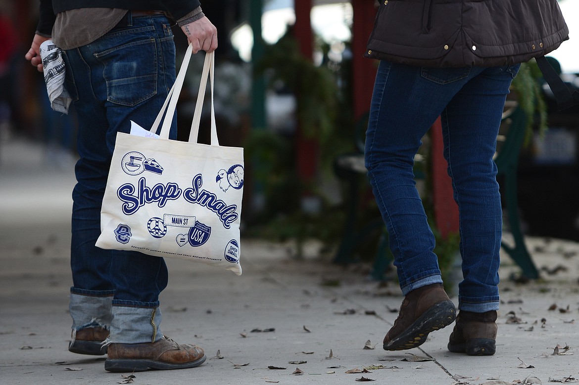 Shoppers walk along Central Avenue in Whitefish during a Small Business Saturday event on Nov. 25. (Casey Kreider/Daily Inter Lake)