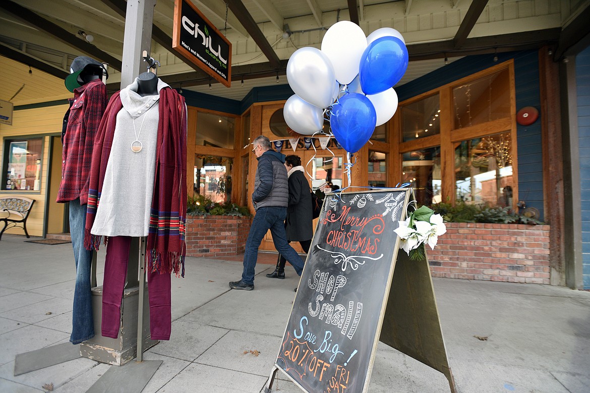 Shoppers walk along East Second Street in Whitefish during a Small Business Saturday event on Nov. 25. (Casey Kreider/Daily Inter Lake)