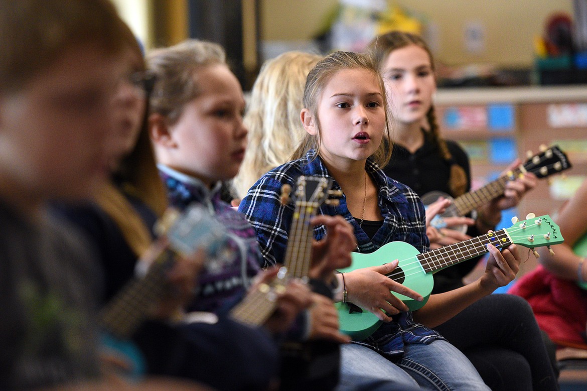 Brinly Youso, a fourth-grader at Bigfork Elementary School, plays a ukulele as part of a new program taught by teacher Heather Epperly on Nov. 15. (Casey Kreider photos/Daily Inter Lake)