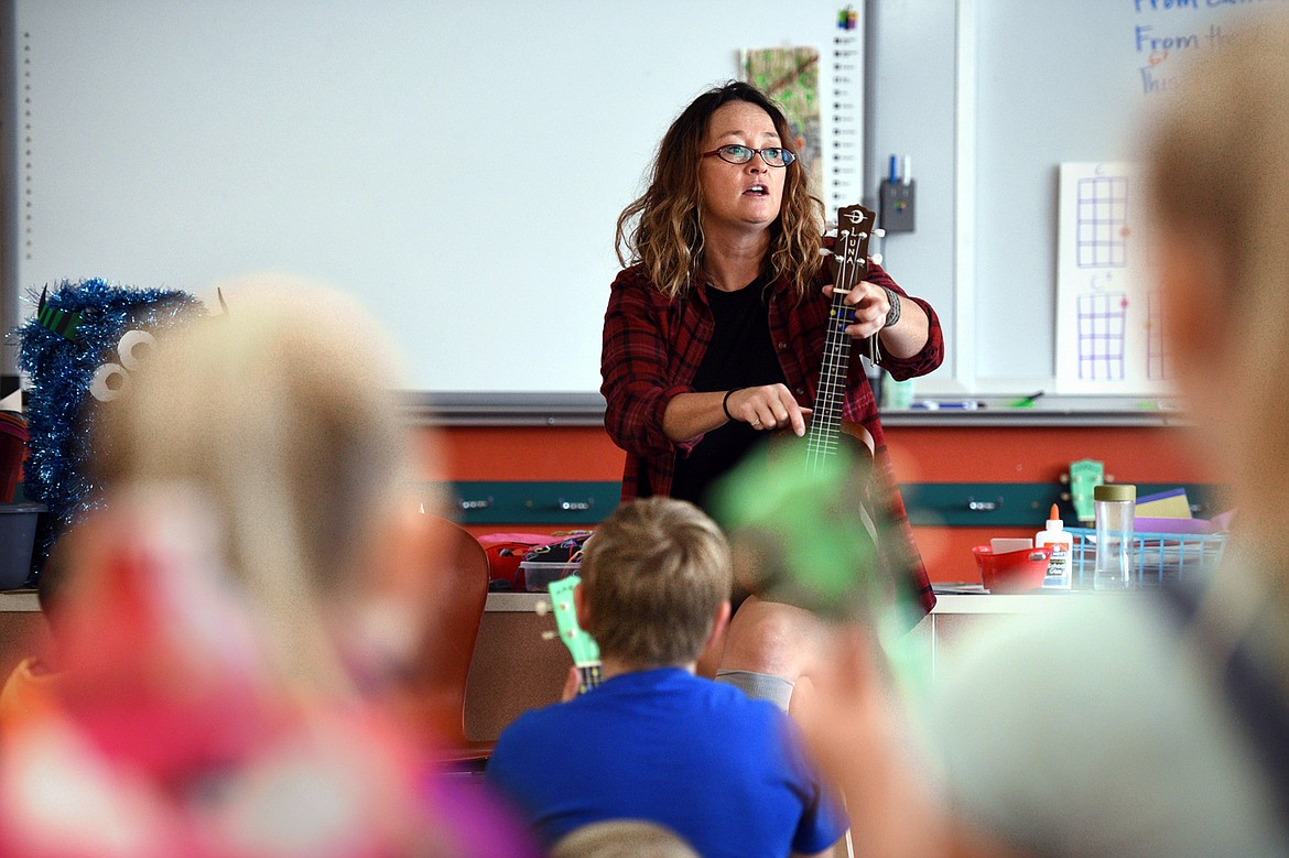Heather Epperly teaches fourth-graders to play the ukulele as part of a new program at Bigfork Elementary School.