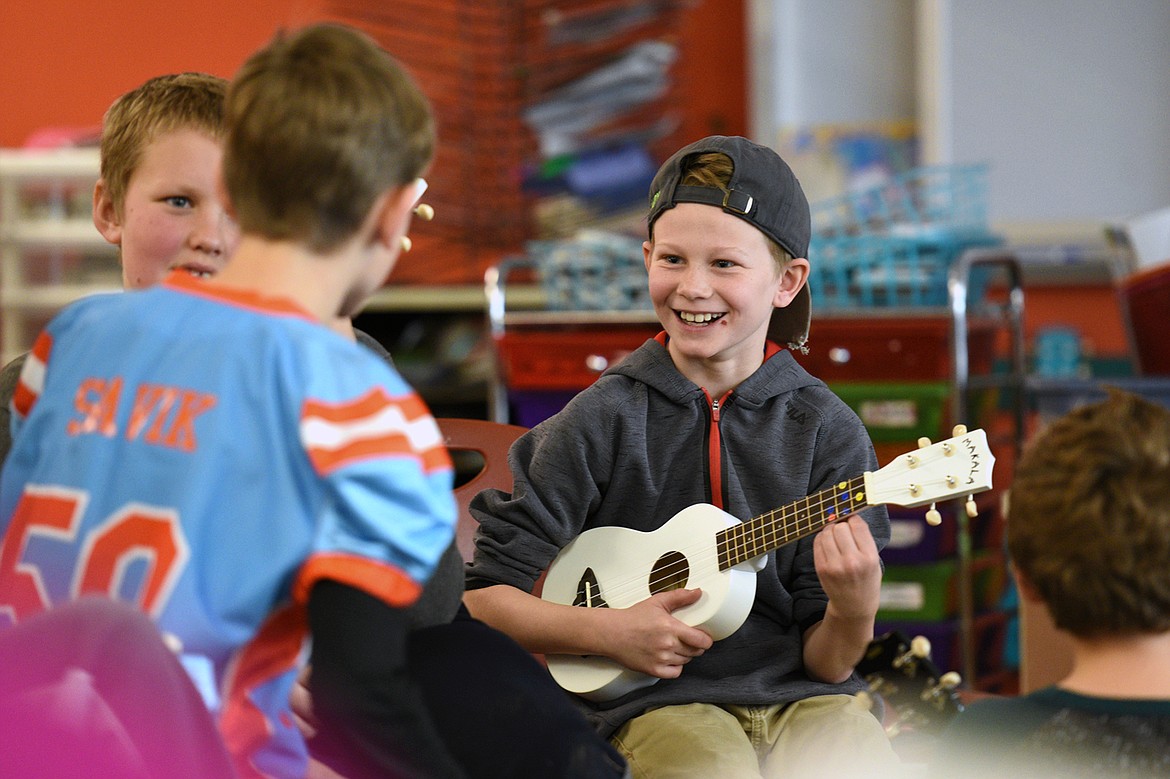Grady Campbell, a fourth-grader at Bigfork Elementary School, plays the ukulele as part of a new program in teacher Heather Epperly&#146;s class on Wednesday, Nov. 15. (Casey Kreider/Daily Inter Lake)