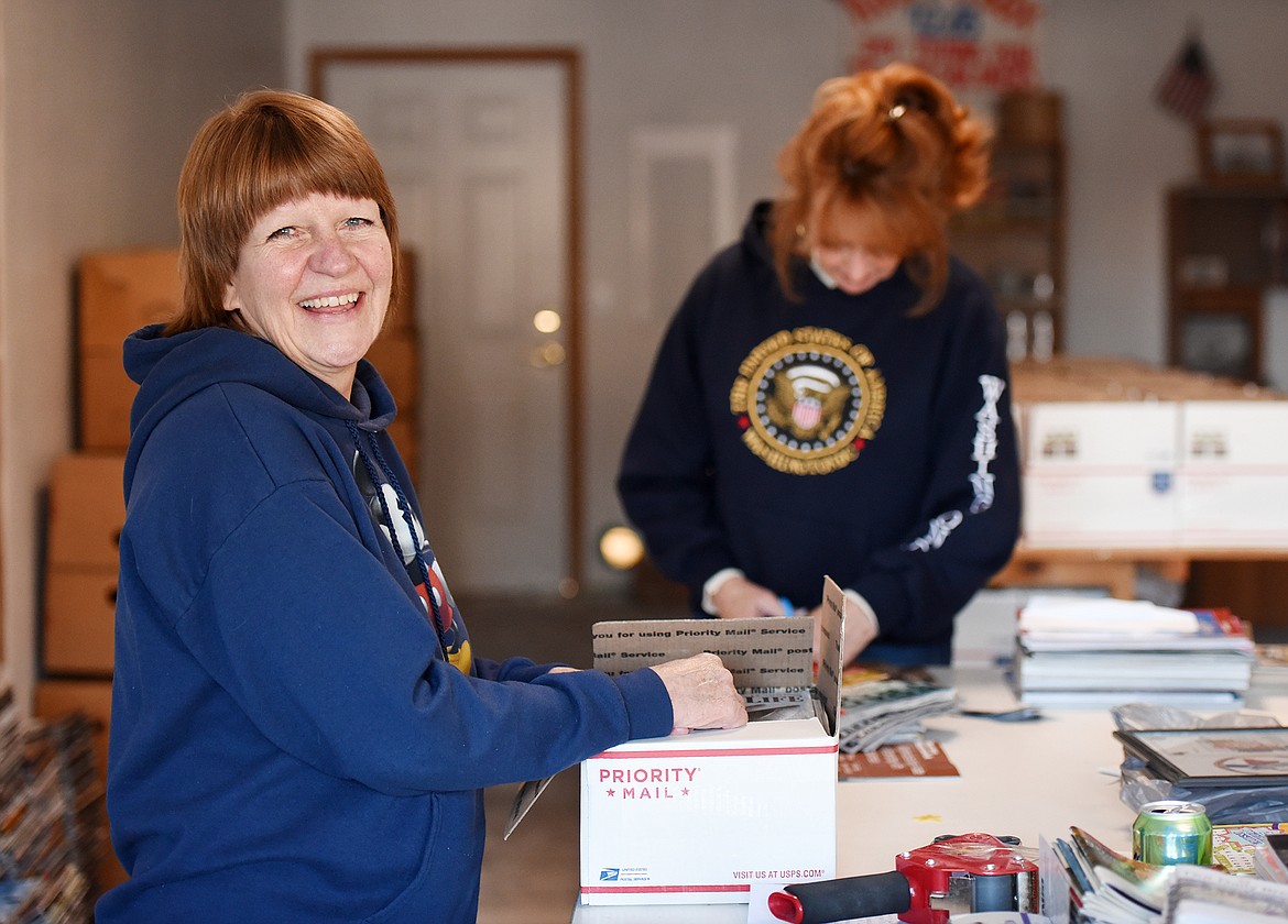 Donna Chase, foundress of Magazines for Troops helps ready this month's shipment of 37 packed and ready boxes containing an average of 40 magazines each for those who are deployed. Each box needs $13.60 in postage. Magazines for Troops is a 501C3 and donations are tax deductible. Their biggest need is money for postage, this month their postage costs alone are likely to be more than $500.(Brenda Ahearn/Daily Inter Lake)