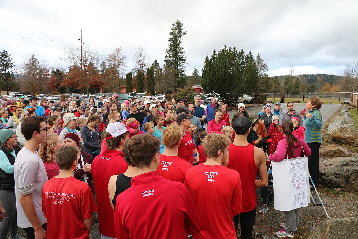(Photo by CAROLINE LOBSINGER)
Sandpoint West Athletic Club's Sue Helander lets Turkey Trot participants that it's almost time for the start of the 10th annual Turkey Trot. The event, which is sponsored by Sandpoint Parks &amp; Recreation and Sandpoint West Athletic Club, raises donations and food for the Bonner Community Food Bank.