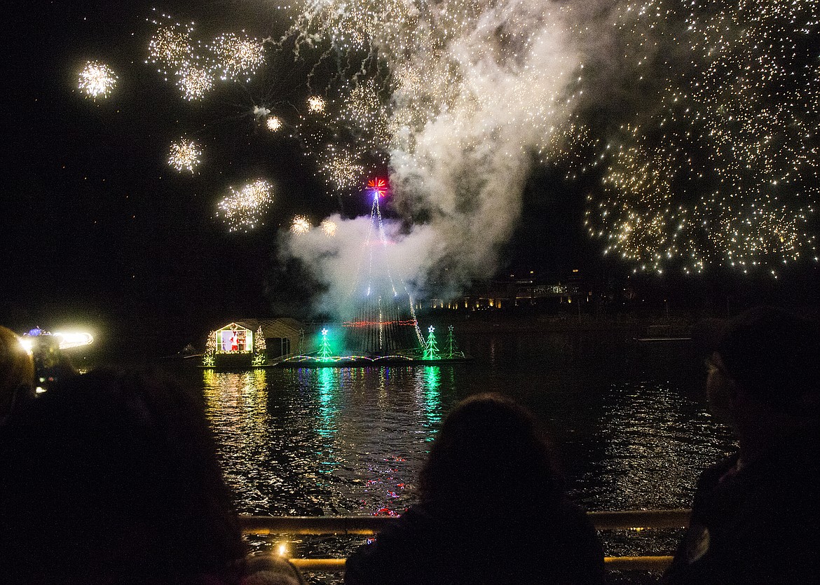 LOREN BENOIT/PressGuests aboard a cruise boat watch fireworks explode in the sky Tuesday night at the North Pole.