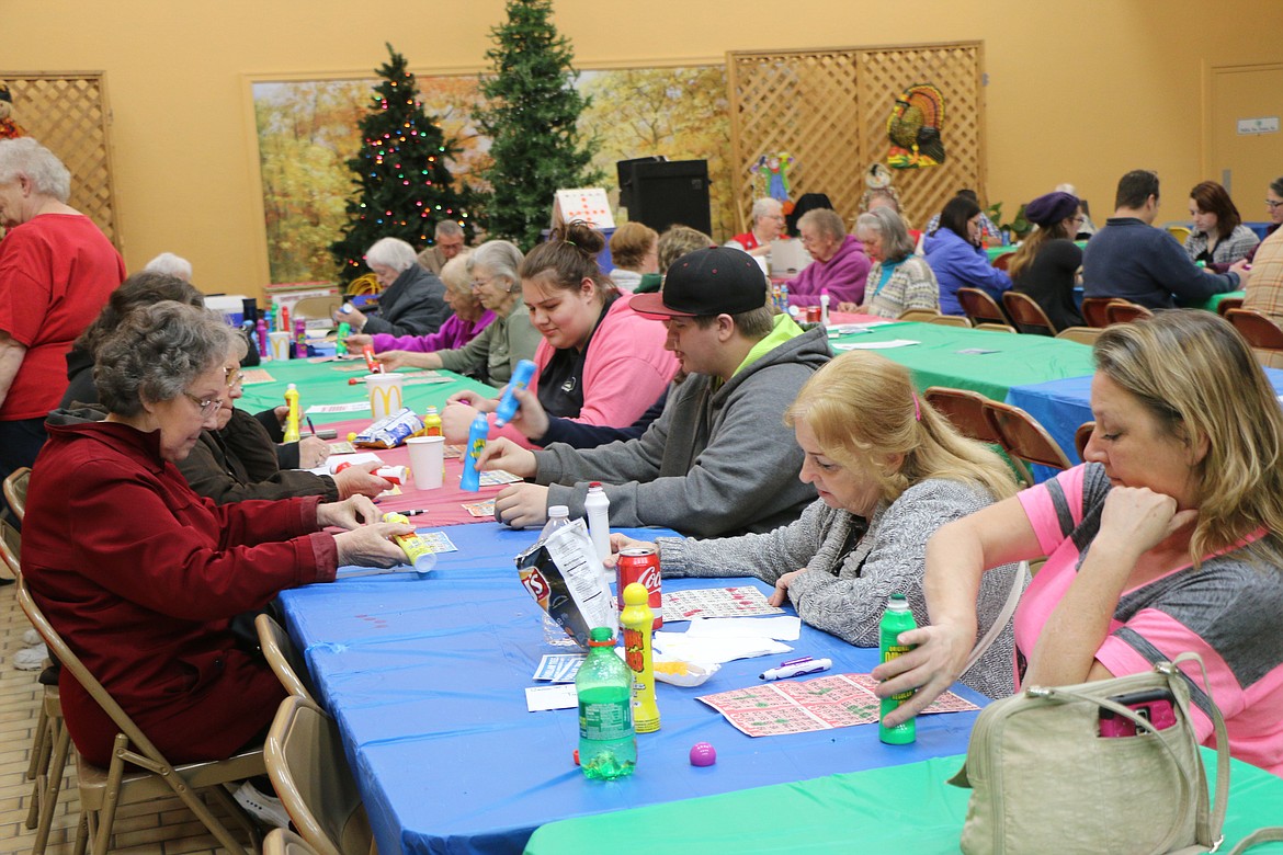 (Photo by CAROLINE LOBSINGER)Bingo players await the next number at the Sandpoint Lions Club's annual turkey bingo fundraiser. More than $2,800 was raised over the two days of the event for the Lions' annual Toys for Tots campaign.