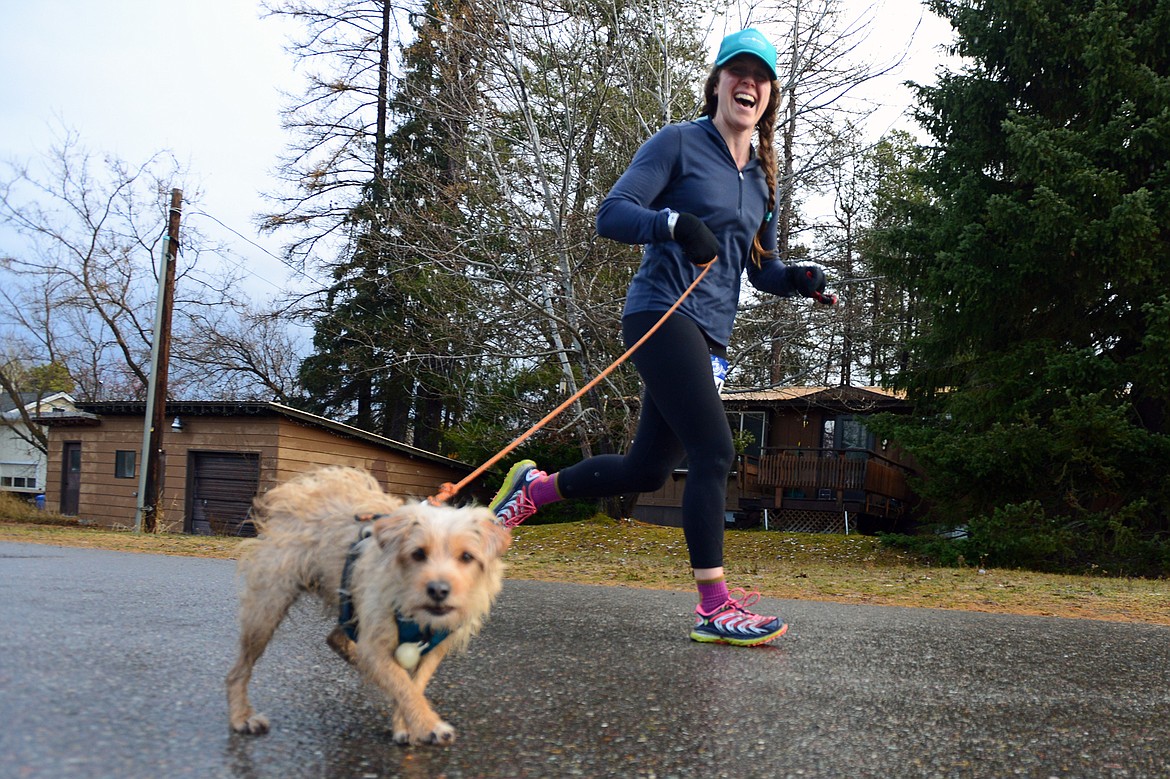 Laura Brown, of Columbia Falls, and her dog Sage, participate in the Whitefish Turkey Trot on Thursday, Nov. 23. (Casey Kreider/Daily Inter Lake)