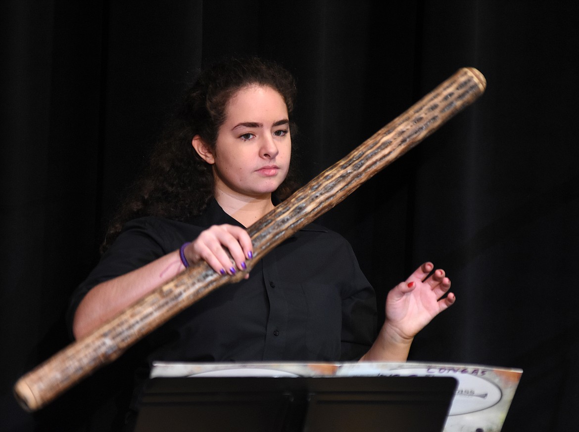 Kathryn Rossi plays the rain stick during a recent performance at Whitefish High School. The high school Percussion Ensembel and Birdland Jazz Combo performed for Muldown Elementary students. (Heidi Desch/Whitefish Pilot)