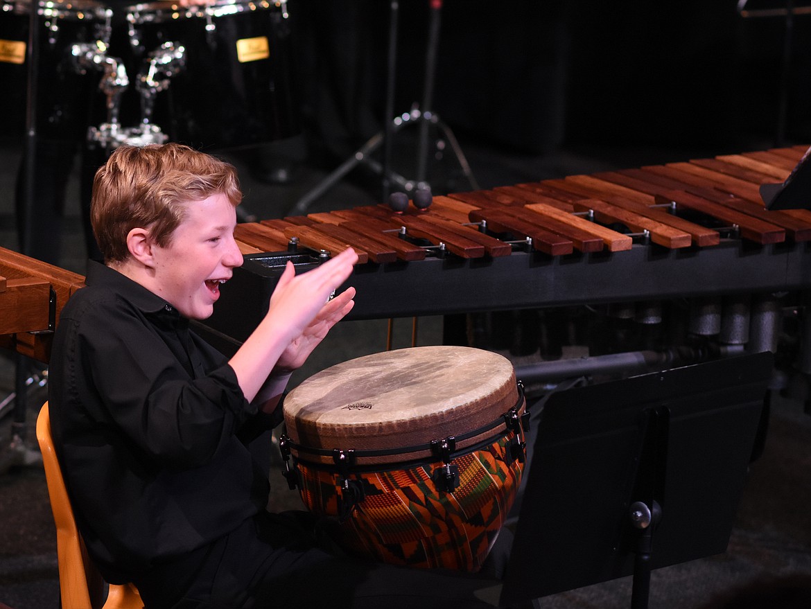 Whitefish High School student Turner Haugen demonstrates the djembe drum for Muldown Elementary students during a recent performance at the high school. The WHS Percussion Ensembel and Birdland Jazz Combo performed for Muldown students. (Heidi Desch/Whitefish Pilot)