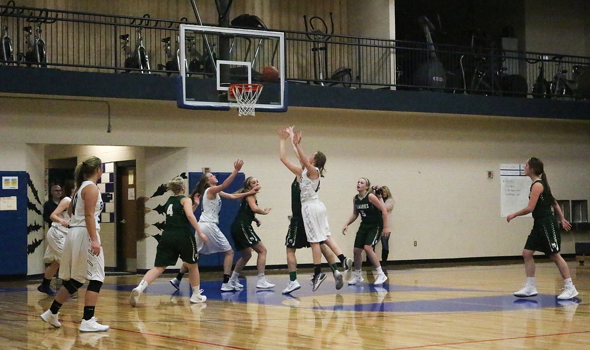 Photo by Mandi Bateman
Teammates offer team support as the St. Maries team works their defensive skills.