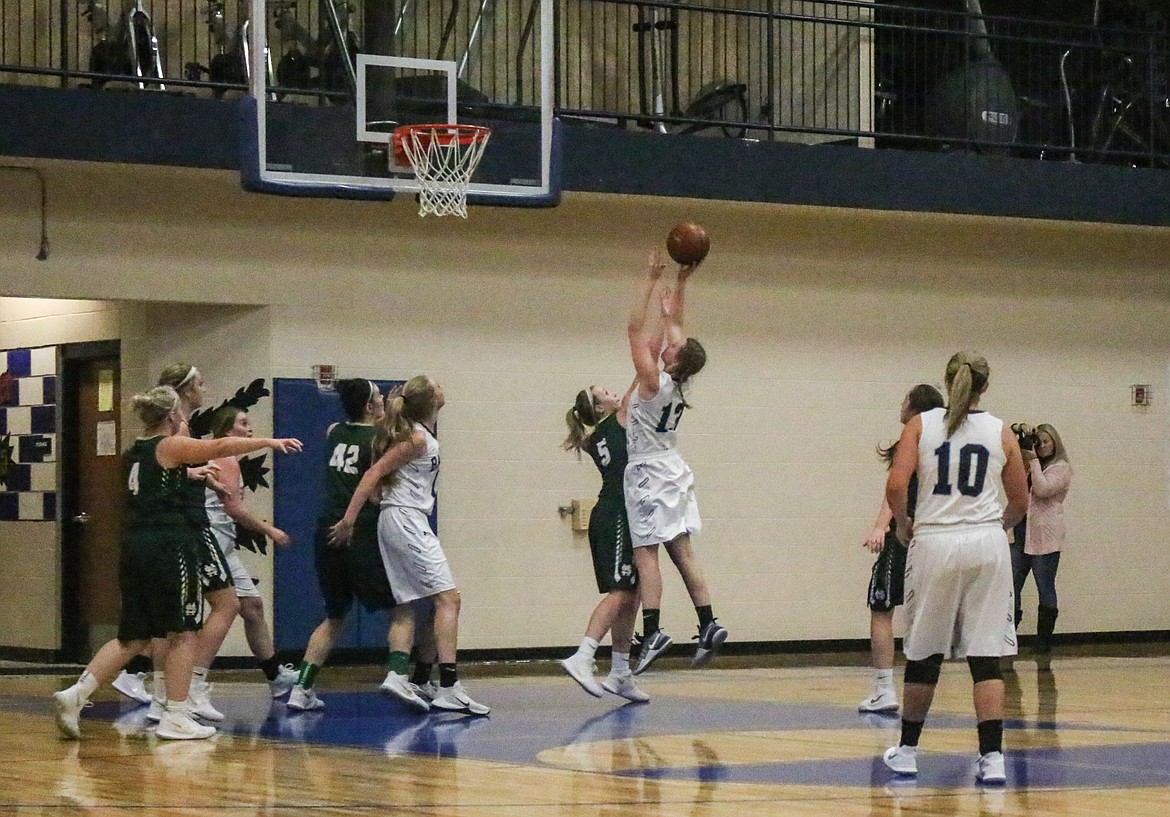 Miranda Wenk puts up a shot in the lane. Wenk had nine points and 18 rebounds in the Badgers&#146; win over visiting St. Maries.