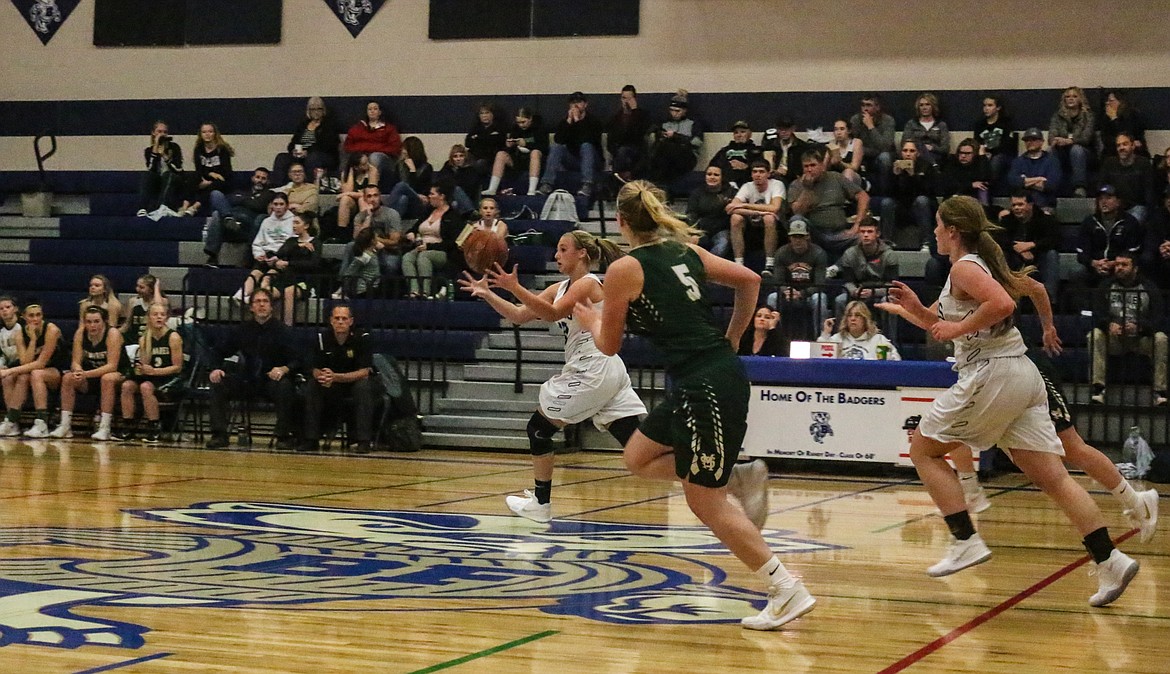 Photos by Mandi Bateman
With speed and teamwork, the Badgers advance the ball on a fast-break in their Nov. 17 game.