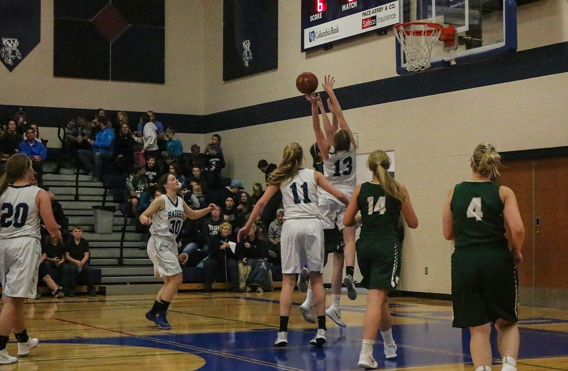 Photo by Mandi Bateman
Lady Badgers battle St. Maries ladies in a defensive standoff.