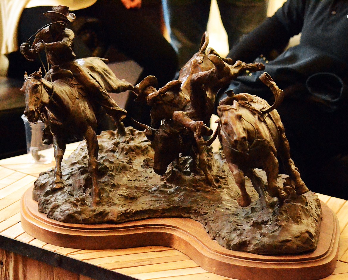 A massive bronze statue that reflects the Montana cowboy is the centre piece around the three beautiful leather couches in the main sitting area (Erin Jusseaume/ Clark Fork Valley Press)