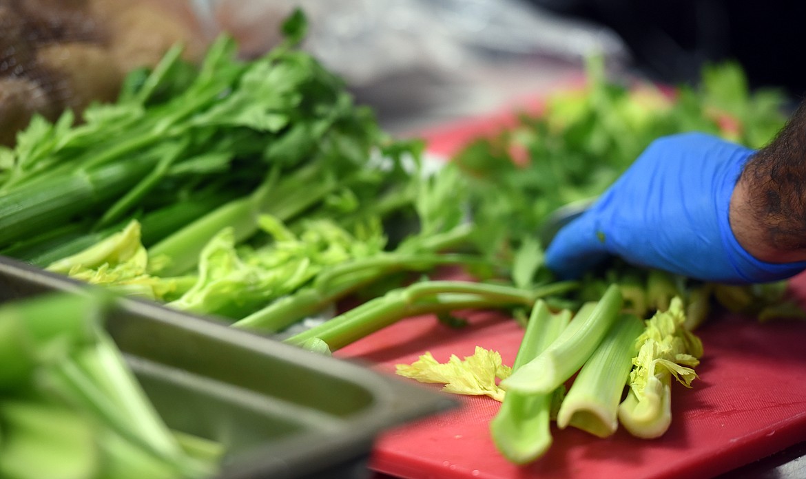 Tony Traina chopping celery to add to a soup at GreenGo&#146;s in Whitefish, on Thursday, November 2.
(Brenda Ahearn/Daily Inter Lake)