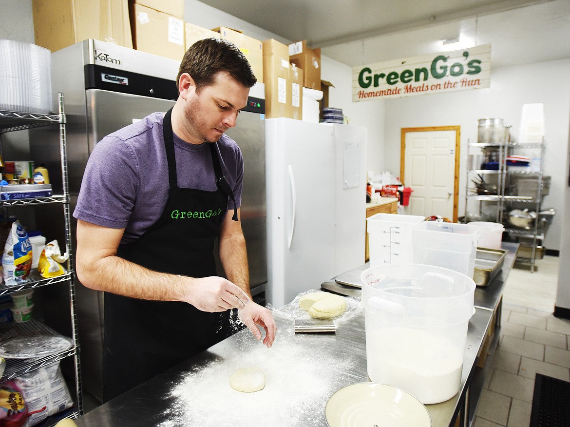 Curtis Green, owner of GreenGo&#146;s in Whitefish, rolls out tops for the chicken pot pies he made on Thursday, Nov. 2. The chicken pot pies are sold in two sizes, mediums are $13, and single sized pies are $6. (Brenda Ahearn/Daily Inter Lake)