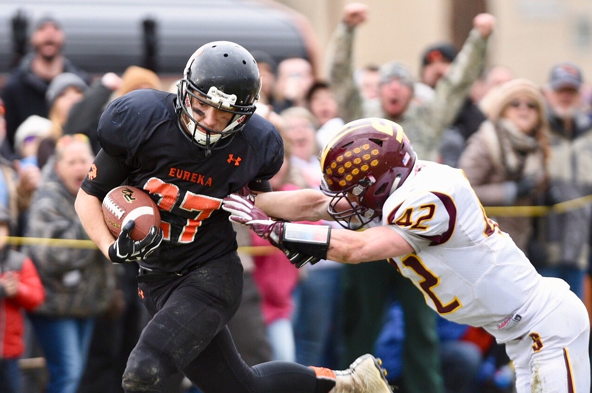 Eureka defensive back Bryant Little is tackled by Shelby running back Zach Torgerson at the 1-yard line on an interception return in the fourth quarter. (Casey Kreider photo/Daily Inter Lake)