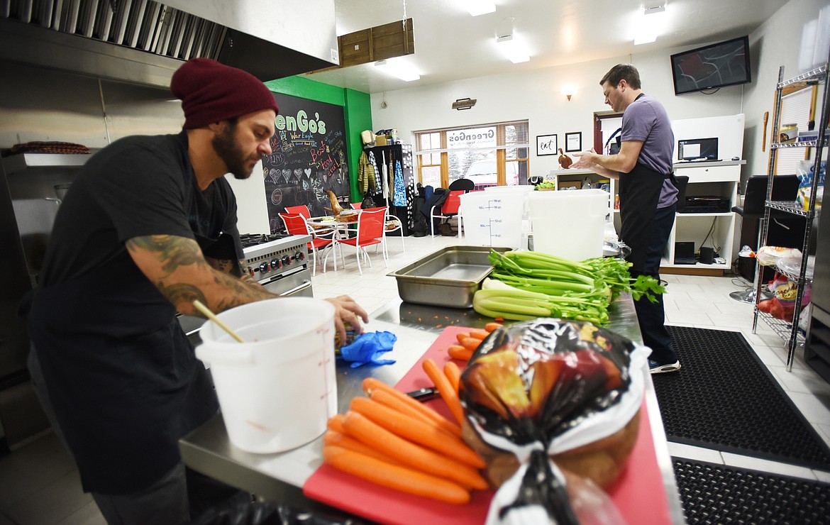 Tony Traina, left, chops and prepares vegetables for a soup at GreenGo&#146;s in Whitefish on Nov. 2. (Brenda Ahearn/Flathead Journal)