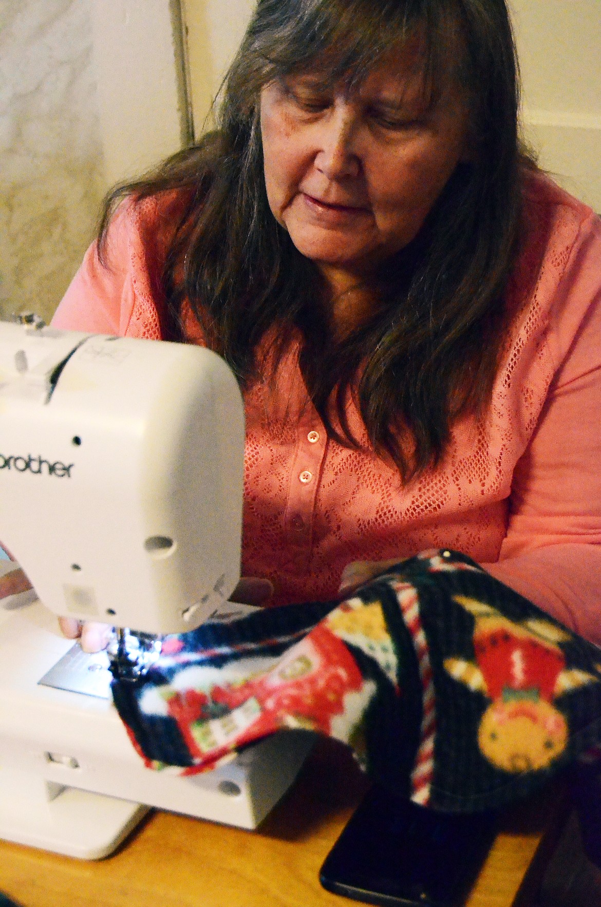 Margret Storay sews a stocking at the women&#146;s gathering. (Erin Jusseaume/ Clark Fork Valley Press)