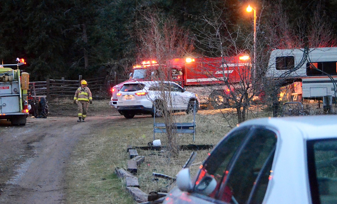 Plains fire crews respond to a structure fire Sunday on Montana 135. (Erin Jusseaume/ Clark Fork Valley Press)