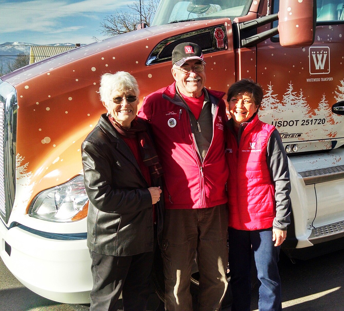 Surrounded by beauty, Larry poses with wife Mary Ann and his cousin Donna Redmond in front of the truck as the ladies prepare to switch out as Larry&#146;s co-pilots (Clark Fork Valley Press)