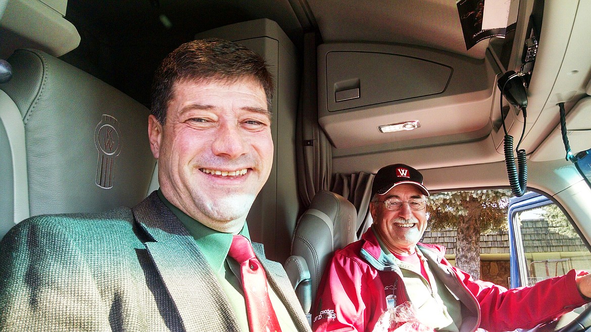 Plains Superintendent Thom Chisholm with Larry Spiekermeier aboard the Big Sky Kenworth. Both excited to see the many smiles on the kids faces as they get thisonce in a lifetime opportunity. (Clark Fork Valley Press)