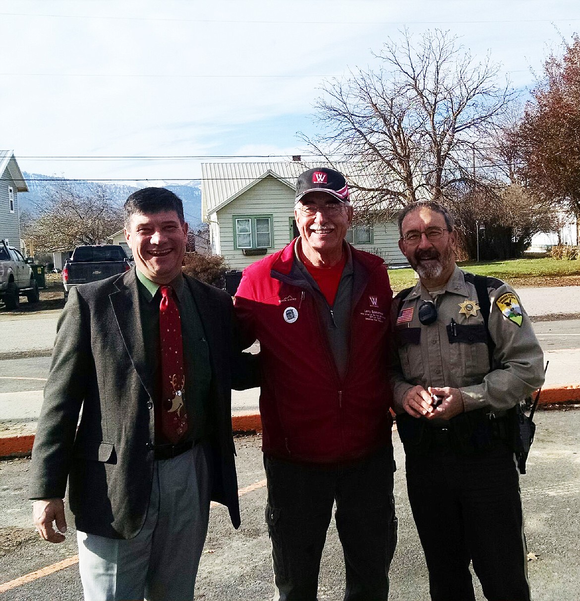 Larry Spiekermeier (centre) with Thom Chisholm and Sanders County Sheriff Tom Rummel getting some extra pats on the back for the 3,000 mile journey he had ahead of him. (Clark Fork Valley Press)