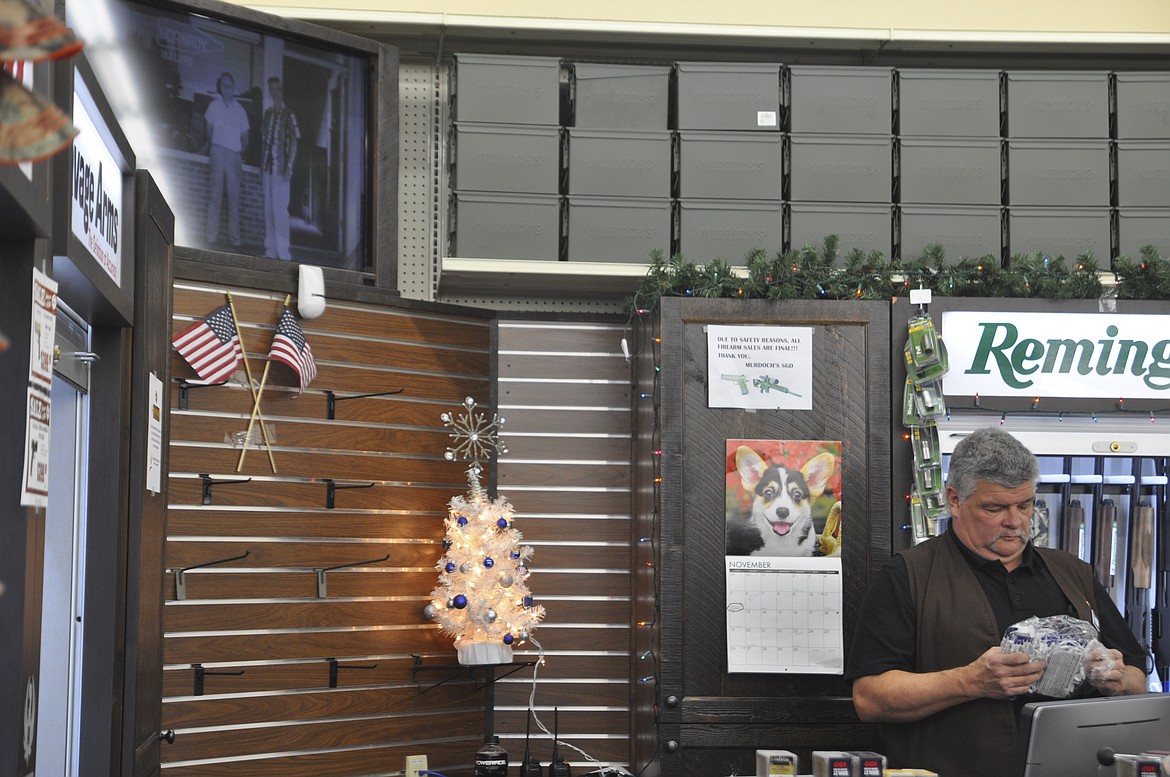 Bob Stover, a sporting goods Specialist at Murdoch&#146;s Ranch and Supply in Polson, untangles strands of Christmas lights. (Ashley Fox/Lake County Leader)