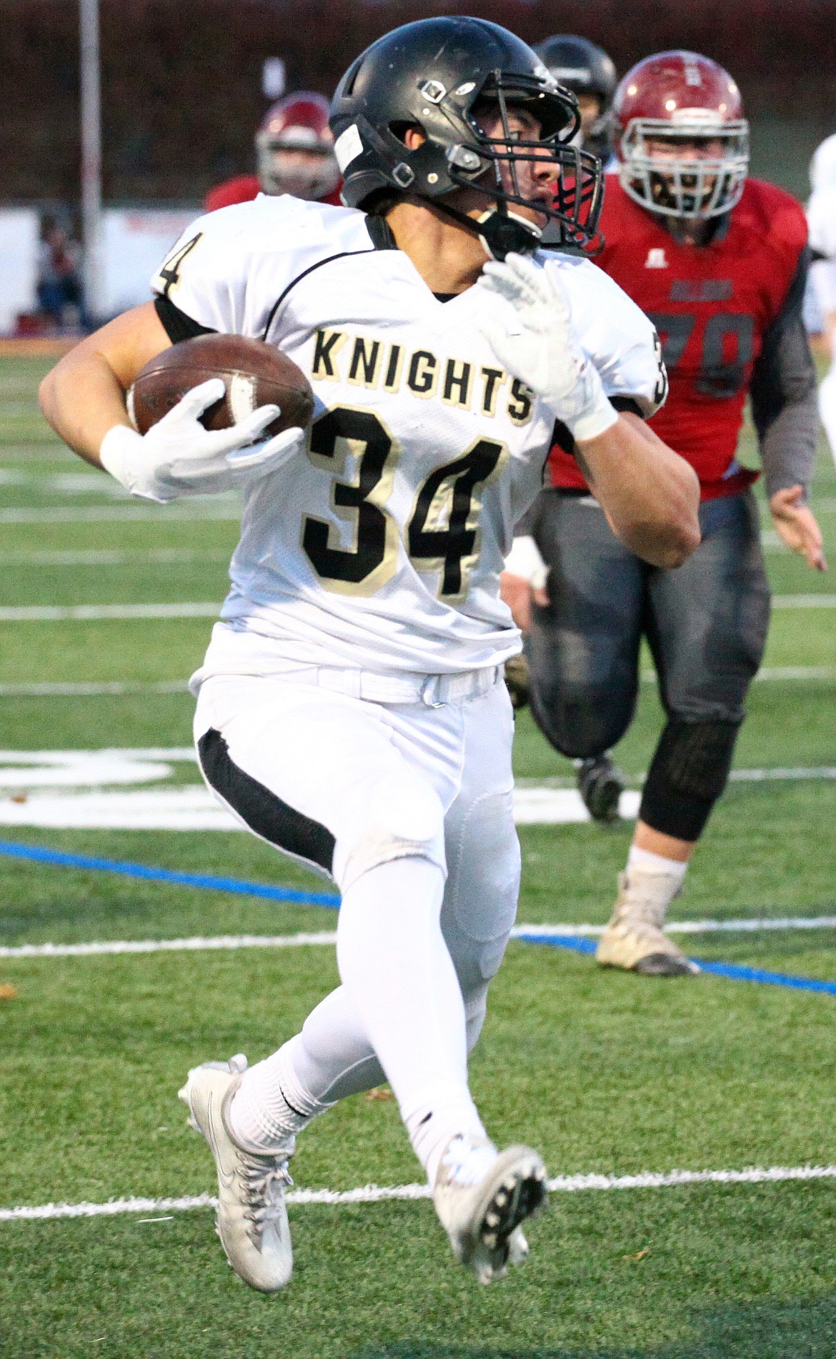 Rodney Harwood/Columbia Basin Herald
Royal running back Alonso Hernandez (34) breaks off another long run in the first quarter of Saturday's 1A quarterfinal game at the Apple Bowl in Wenatchee. Hernandez finished with 198 yards and three touchdowns in the Knights 49-0 win over Okanogan.