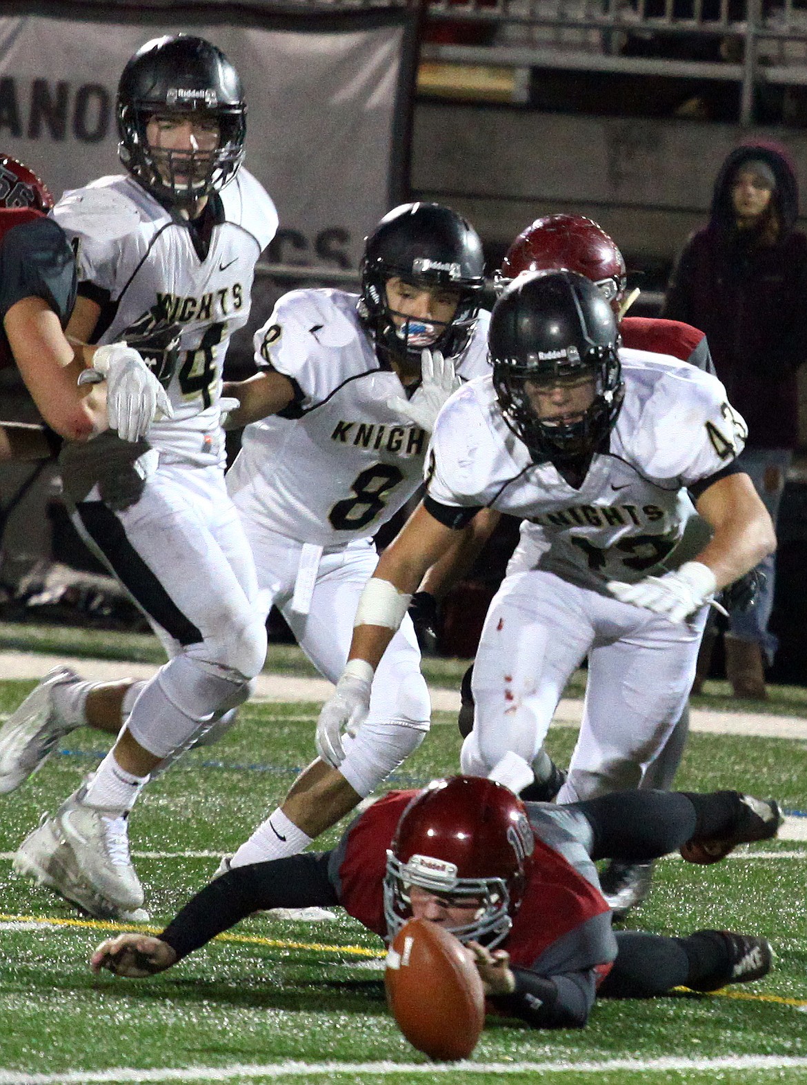 Rodney Harwood/Columbia Basin HeraldOkanogan quarterback Alex Nelson scrambles for a fumble in the second half. The Royal defense created five turnovers during Saturday night's 1A state quarterfinal game at the Apple Bowl in Wenatchee.