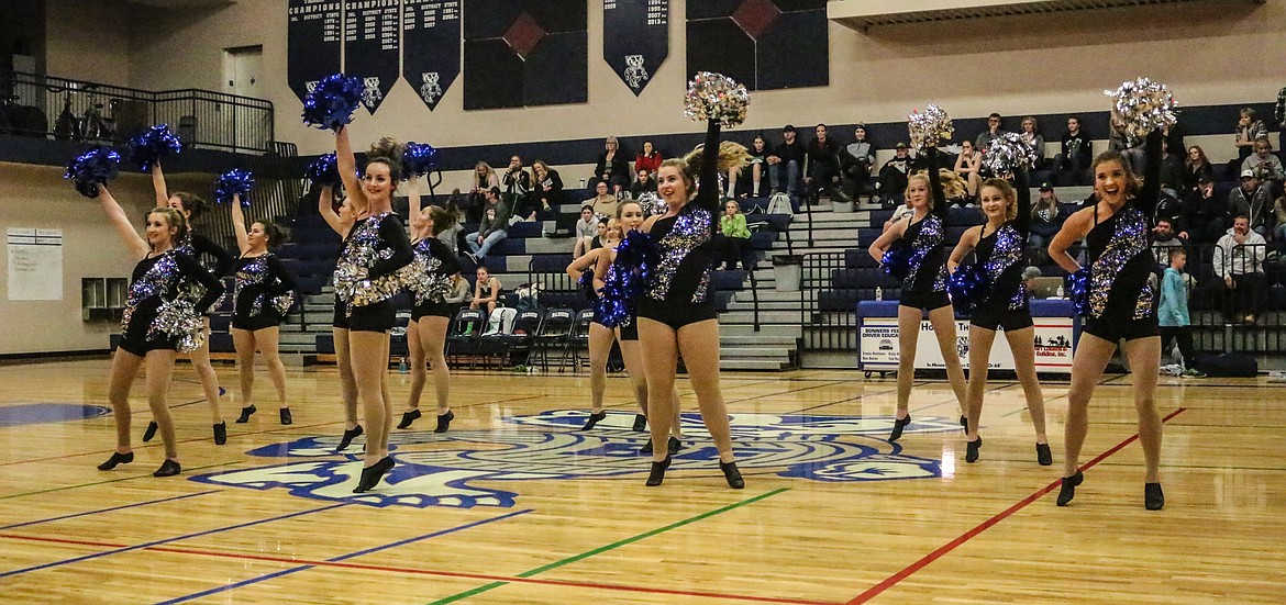 Photo by Mandi Bateman
The Badgerettes raising their Poms high, showing their Badger pride,