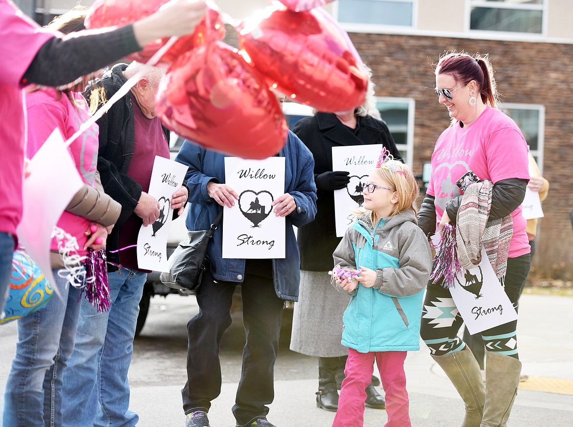 Willow Henke, 6, saying hello to gathered friends and family before she goes in for her last chemo treatment on Wednesday, November 29, at The Rock at Kalispell Regional Medical Hospital.(Brenda Ahearn/Daily Inter Lake)
