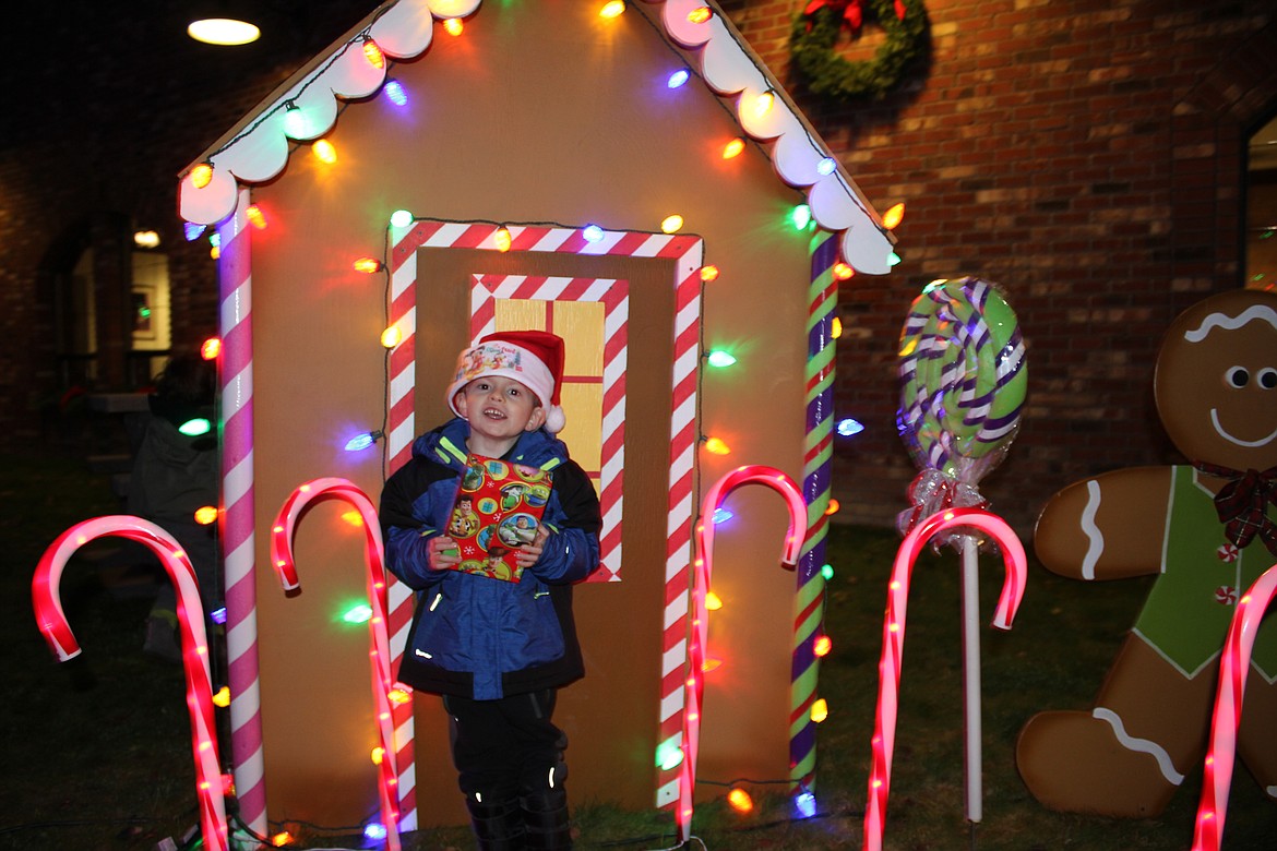 Photo by Tanna Yeoumans
Zachary Hegler held tight to his gift for Santa as he patiently waited his turn.