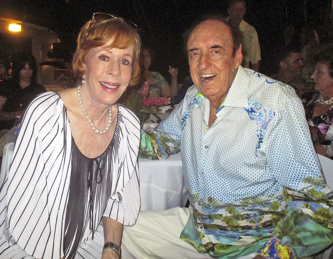 FILE - In this June 12, 2015 file photo, Jim Nabors and his friend and longtime collaborator in comedy Carol Burnett celebrate Nabors&#146; 85th birthday at his home in Honolulu. Nabors died peacefully at his home in Honolulu on Thursday, Nov. 30, 2017, with his husband Stan Cadwallader at his side. He was 87. (John Berger/Honolulu Star-Advertiser via AP, File)
