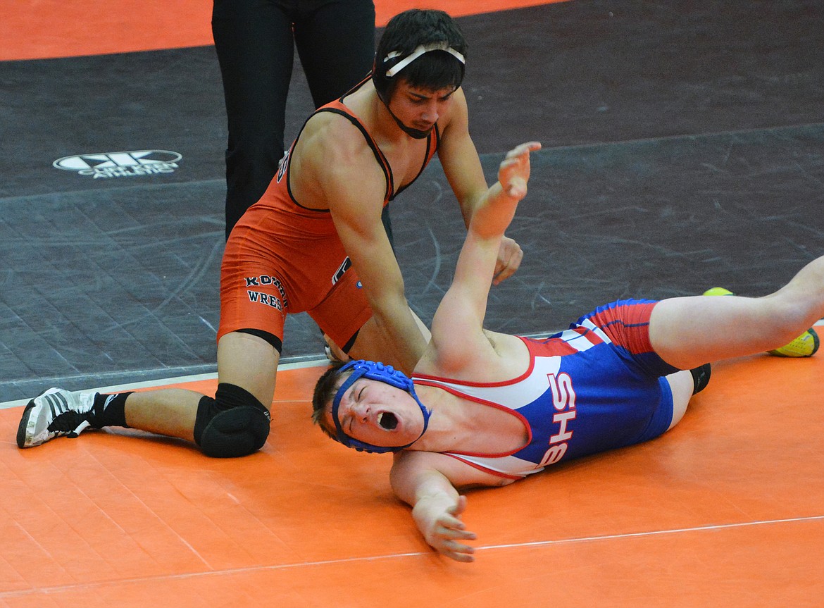 RONAN WRESTLER Tyler Houle attempts to pin a Bigfork wrestler at the Western Montana Duals at the Ronan Events Center. (Jason Blasco/Lake County Leader)