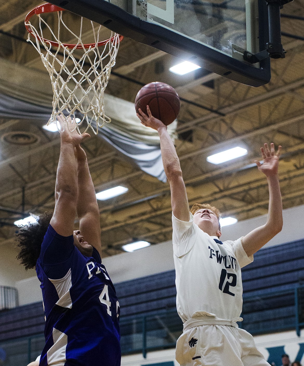 LOREN BENOIT/Press

Lake City guard Nic McCartin goes for a layup against Pasco&#146;s Kashon Tate Friday night at Lake City High School.