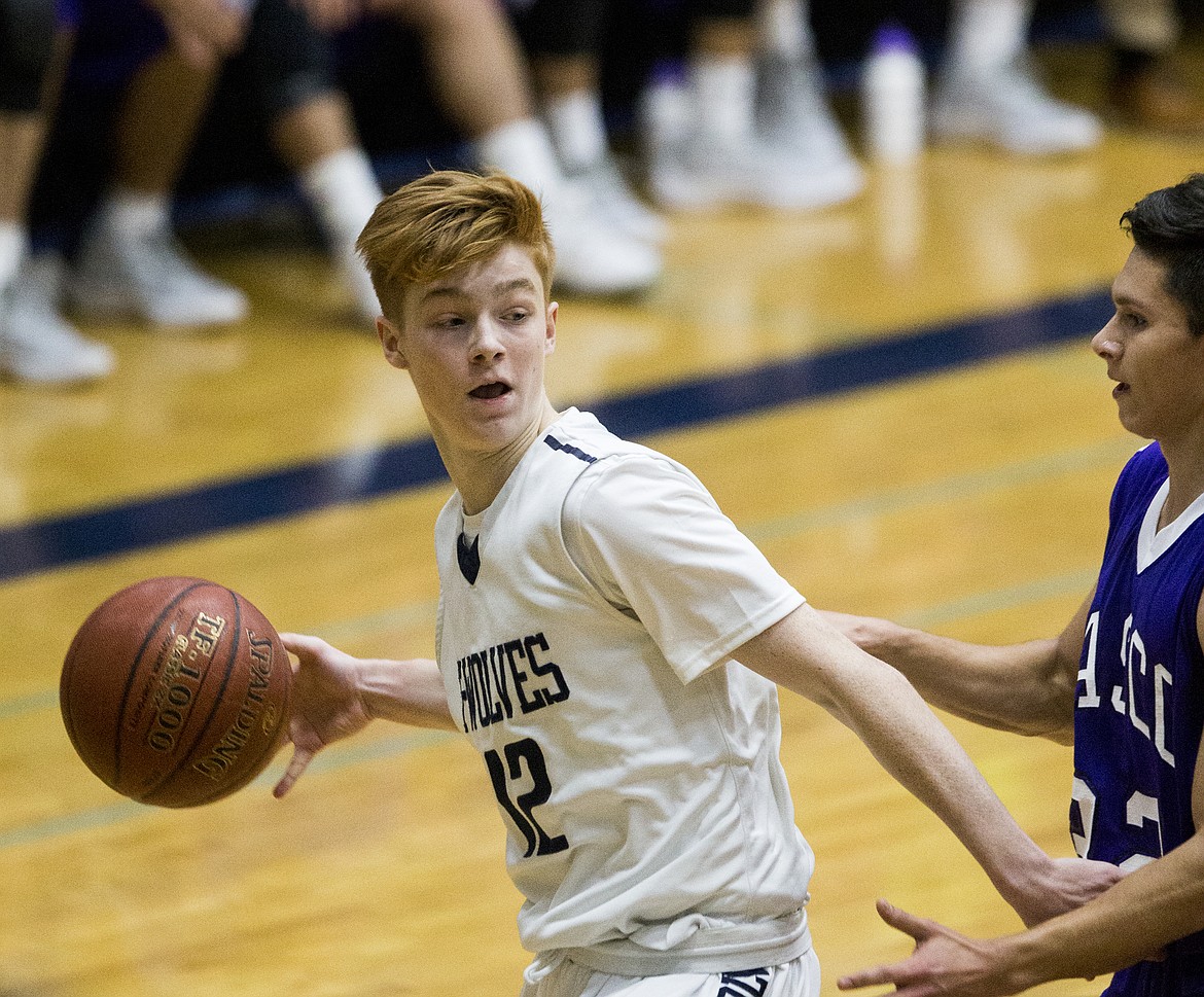 LOREN BENOIT/Press

Lake City&#146;s Nic McCartin dribbles the ball towards the paint  during Friday night&#146;s game at Lake City High School.