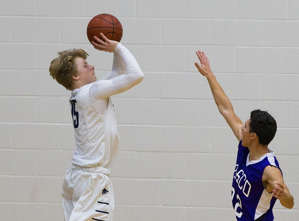 LOREN BENOIT/Press

Lake City&#146;s Hunter Schaffer shoots a three-pointer over Pasco defender Moises Cuevas during Friday night&#146;s game at Lake City High School.