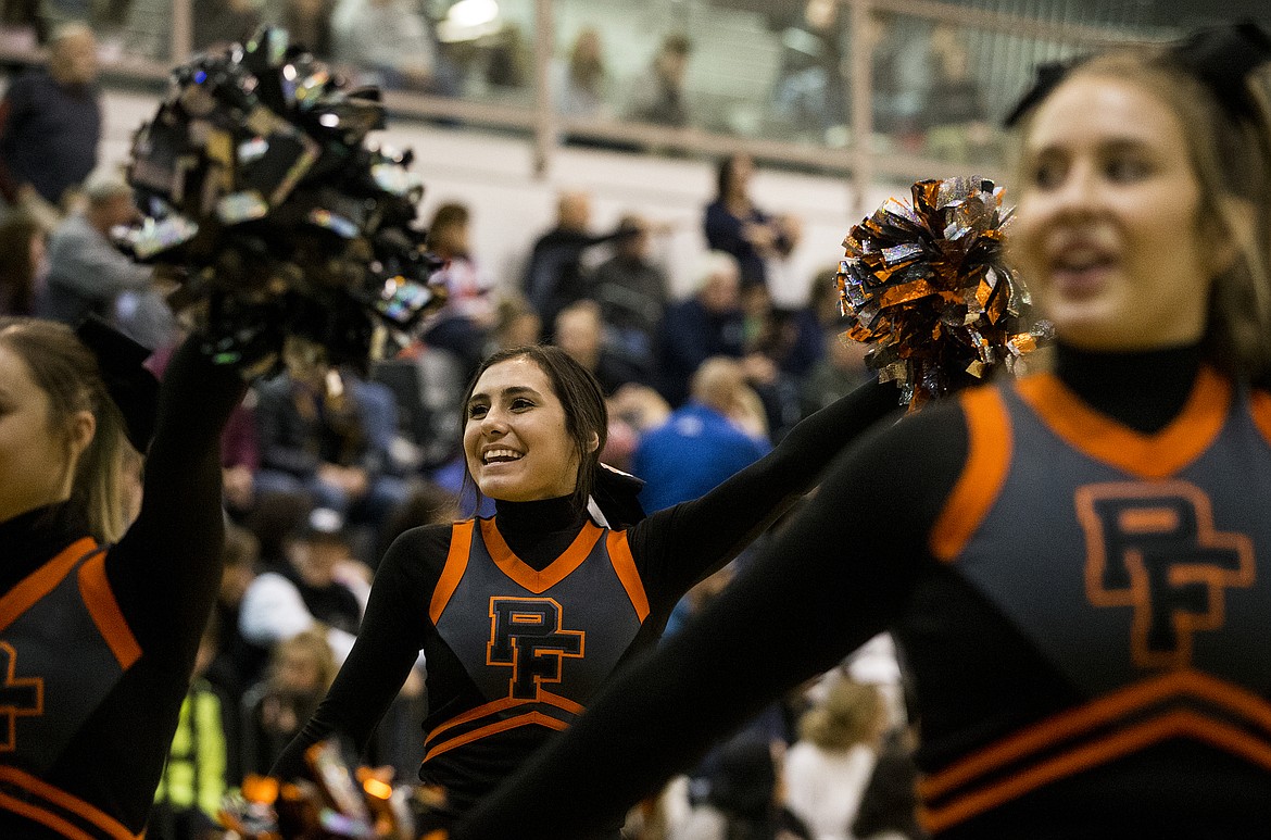 LOREN BENOIT/Press

Post Falls cheerleaders pump up the student section during Thursday night&#146;s game.