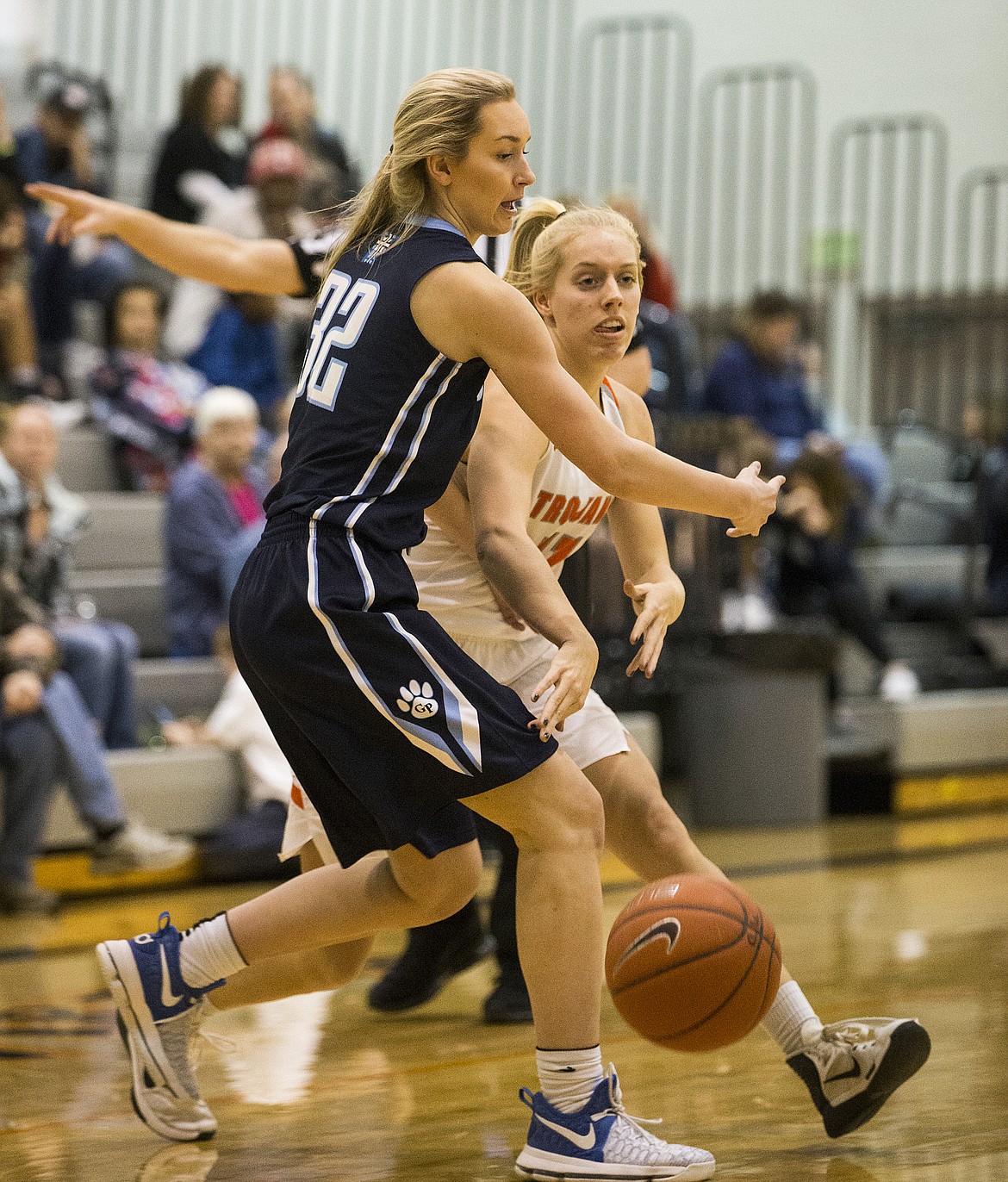 LOREN BENOIT/PressJenna Gardiner passes the ball to a teammate around Gonzaga Prep defender Kerynica Keyes Thursday night at Post Falls High School.